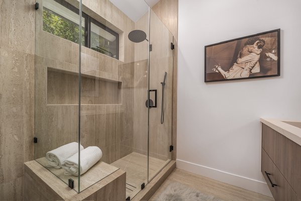 Serene Master Suite Remodel in Woodland Hills, CA - Transforming outdated spaces into spa-like sanctuaries, this master suite remodel in Woodland Hills, CA, showcases our attention to detail and premium craftsmanship at Build Trust Remodeling. We completely reimagined the layout to maximize space and functionality across the master bedroom, bathroom, and expansive closet, creating a cohesive retreat that promotes relaxation and healthier living. The bedroom features a luxurious terracotta upholstered headboard, crisp white bedding, wide-plank hardwood flooring, and recessed lighting for a bright, airy ambiance, with seamless access to the outdoors via large sliding doors. In the bathroom, we installed a custom-built vanity with warm wood cabinetry, elegant travertine tilework, modern black fixtures, and a walk-in shower with frameless glass enclosure, built-in bench, and rainfall showerhead—every element from energy-efficient lighting to high-quality plumbing was carefully selected and expertly installed to reflect both luxury and practicality. The expansive walk-in closet boasts custom light wood shelving, drawers, and hanging rods for organized, effortless storage. Completed with minimal disruption and at a competitive price, this remodel boosts your home's value while turning daily routines into a five-star experience that exceeds expectations. Services include: Custom Vanity and Cabinetry, Tile Installation, Fixture Upgrades, Layout Redesign, Closet Organization Systems, and Lighting Integration. Serene Master Suite Remodel in Woodland Hills, CA - Transforming outdated spaces into spa-like sanctuaries, this master suite remodel in Woodland Hills, CA, showcases our attention to detail and premium craftsmanship at Build Trust Remodeling. We completely reimagined the layout to maximize space and functionality across the master bedroom, bathroom, and expansive closet, creating a cohesive retreat that promotes relaxation and healthier living. The bedroom features a luxurious terracotta upholstered headboard, crisp white bedding, wide-plank hardwood flooring, and recessed lighting for a bright, airy ambiance, with seamless access to the outdoors via large sliding doors. In the bathroom, we installed a custom-built vanity with warm wood cabinetry, elegant travertine tilework, modern black fixtures, and a walk-in shower with frameless glass enclosure, built-in bench, and rainfall showerhead—every element from energy-efficient lighting to high-quality plumbing was carefully selected and expertly installed to reflect both luxury and practicality. The expansive walk-in closet boasts custom light wood shelving, drawers, and hanging rods for organized, effortless storage. Completed with minimal disruption and at a competitive price, this remodel boosts your home's value while turning daily routines into a five-star experience that exceeds expectations. Services include: Custom Vanity and Cabinetry, Tile Installation, Fixture Upgrades, Layout Redesign, Closet Organization Systems, and Lighting Integration.