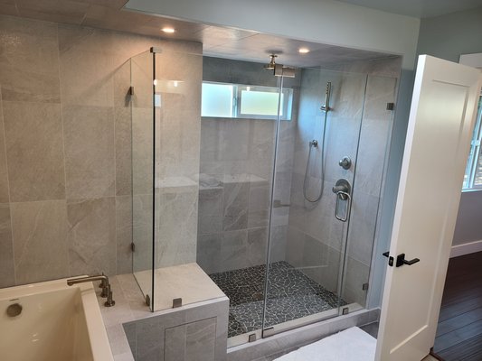 Clayton Bathroom Transformation - We transformed this outdated 1970s bathroom, plagued by dry rot and worn fixtures, into a sleek, modern retreat. The renovation included all-new plumbing, moisture-resistant materials, and high-end finishes. Fresh tile, a spacious glass-enclosed shower, custom vanity, and elegant lighting created a luxurious, spa-like feel. Now, it’s a stunning blend of style and durability, built to last.