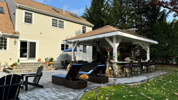 Pavilion and outdoor kitchen - I want to share some before and after pictures of a recent project. A pavilion and outdoor kitchen in Hanover MA. It features fire pit, outdoor bluestone stairs with led lights, fireplace, bluestone countertop, and built in grill and refrigerator.