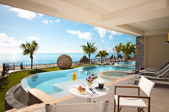 All-Inclusive Luxury Resorts - Indulge in the epitome of luxury at one of our hand-selected all-inclusive resorts, where every moment is a seamless blend of extravagance and relaxation. Nestled along pristine coastlines, our partner resorts boast infinity pools that seemingly merge with the azure expanse of the ocean, offering a breathtaking panorama that transforms each stay into a visual masterpiece. Immerse yourself in a world of unmatched sophistication, where personalized service, gourmet dining, and lavish accommodations converge to create an unforgettable escape. Whether you are unwinding in a private cabana by the pool or savoring a gourmet meal with the sound of waves as your backdrop, our resorts redefine the art of leisure. Elevate your travel experience to new heights and surrender to the allure of our luxury all-inclusive resorts – the perfect sanctuary for those seeking an unparalleled getaway. All-Inclusive Luxury Resorts - Indulge in the epitome of luxury at one of our hand-selected all-inclusive resorts, where every moment is a seamless blend of extravagance and relaxation. Nestled along pristine coastlines, our partner resorts boast infinity pools that seemingly merge with the azure expanse of the ocean, offering a breathtaking panorama that transforms each stay into a visual masterpiece. Immerse yourself in a world of unmatched sophistication, where personalized service, gourmet dining, and lavish accommodations converge to create an unforgettable escape. Whether you are unwinding in a private cabana by the pool or savoring a gourmet meal with the sound of waves as your backdrop, our resorts redefine the art of leisure. Elevate your travel experience to new heights and surrender to the allure of our luxury all-inclusive resorts – the perfect sanctuary for those seeking an unparalleled getaway.