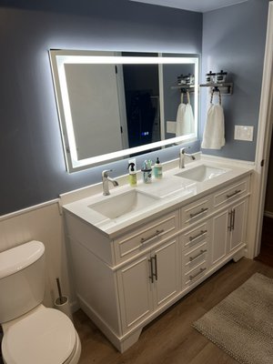 Bathroom Remodel Snohomish - This bathroom remodel was done to one of our returning clients that we built a front porch and a roof overhang. We were asked to remove the single vanity and install a double and disconnect the stackable, washer and dryer and install a countertop over the top. After painting the walls a new color and finishing with new bathroom fixtures the Reno is a wrap. Bathroom Remodel Snohomish - This bathroom remodel was done to one of our returning clients that we built a front porch and a roof overhang. We were asked to remove the single vanity and install a double and disconnect the stackable, washer and dryer and install a countertop over the top. After painting the walls a new color and finishing with new bathroom fixtures the Reno is a wrap.