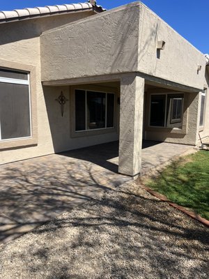Paver patio - In this project the owner had a drainage issue that shifted the water towards the house, so he decided to put down some pavers with a small slope that started connected to the driveway all the way back over the existing patio and it came out great with the beautiful native color from phx pavers.