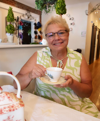 Meet the Owner Gaye Box - ✨Hello all! Its time to introduce myself formally, the lady behind the tea room! I'm Gaye Box, the owner of Enchanted Gatherings Tea Room, and I’m passionate about providing an experience that you will always remember. When was the last time you sat at a table draped in fine linens, set with bone china, crystal stemware, and polished silverware? At Enchanted Gatherings, I aim to recreate that sense of occasion and elegance.🫖
For those old enough to remember the joy of preparing for a holiday meal or special event with grandma’s China and cut glass serving pieces, I love seeing the expressions on their faces as they reminisce about those cherished times. For the younger ladies, it's incredibly rewarding to witness their delight and surprise as they experience the beauty of a meticulously set table for the first time, stepping back into a world where people took the time to create beautiful settings and make finger sandwiches and sweets just to enjoy visits with friends and family.
At Enchanted Gatherings, it’s not just about the food and tea—it's about recreating those precious moments and creating new memories. Every detail, from the pastries to the ambiance, is designed to transport you to a time when setting a beautiful table was an art, and gathering with loved ones was a cherished tradition. I look forward to welcoming you and sharing this enchanting experience with you!
#EnchantedGatheringsTeaRoom Meet the Owner Gaye Box - ✨Hello all! Its time to introduce myself formally, the lady behind the tea room! I'm Gaye Box, the owner of Enchanted Gatherings Tea Room, and I’m passionate about providing an experience that you will always remember. When was the last time you sat at a table draped in fine linens, set with bone china, crystal stemware, and polished silverware? At Enchanted Gatherings, I aim to recreate that sense of occasion and elegance.🫖
For those old enough to remember the joy of preparing for a holiday meal or special event with grandma’s China and cut glass serving pieces, I love seeing the expressions on their faces as they reminisce about those cherished times. For the younger ladies, it's incredibly rewarding to witness their delight and surprise as they experience the beauty of a meticulously set table for the first time, stepping back into a world where people took the time to create beautiful settings and make finger sandwiches and sweets just to enjoy visits with friends and family.
At Enchanted Gatherings, it’s not just about the food and tea—it's about recreating those precious moments and creating new memories. Every detail, from the pastries to the ambiance, is designed to transport you to a time when setting a beautiful table was an art, and gathering with loved ones was a cherished tradition. I look forward to welcoming you and sharing this enchanting experience with you!
#EnchantedGatheringsTeaRoom