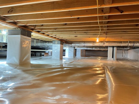 Encapsulation - Job2 - High humidity in the crawlspace was leading to rodents and other critters living in the crawlspace. Also, the customers noted musty smells throughout their home. A full perimeter drain system was installed to drain all excess water from the crawlspace. Once dried out, the depicted encapsulation was completed with the installation of a dehumidifier to regulate humidity to a normal and sustainable level to prevent pests and mold growth. The customr has noted clean air throughout the entire home since installation and is proud of their BDry system and added usable storage space in the crawlspace for holiday decorations.