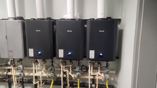 Rinnai CX199 Installation in Hotel - # Commercial Gas Line Repair and Water Heater Replacement
Our team responded to an emergency gas leak from a 2-inch gas line in a hotel's mechanical room. We quickly isolated the leak and replaced the failed T fitting and several deteriorated pipe sections, restoring safe operation.
During inspection, we found three tankless water heaters not operating properly. After diagnostic evaluation, we determined that repairs would be more expensive than replacement. The hotel owner and manager agreed to replace the units for better long-term value.
We removed the failing units and installed three new Rinnai CX199 commercial-grade water heaters, selected for their high efficiency, robust construction, and reliability in heavy-duty commercial applications.
The project successfully addressed the immediate safety concern while upgrading the property's hot water capacity. All work was completed in compliance with local codes, ensuring the hotel's mechanical systems operate safely and efficiently for continued guest service. Rinnai CX199 Installation in Hotel - # Commercial Gas Line Repair and Water Heater Replacement
Our team responded to an emergency gas leak from a 2-inch gas line in a hotel's mechanical room. We quickly isolated the leak and replaced the failed T fitting and several deteriorated pipe sections, restoring safe operation.
During inspection, we found three tankless water heaters not operating properly. After diagnostic evaluation, we determined that repairs would be more expensive than replacement. The hotel owner and manager agreed to replace the units for better long-term value.
We removed the failing units and installed three new Rinnai CX199 commercial-grade water heaters, selected for their high efficiency, robust construction, and reliability in heavy-duty commercial applications.
The project successfully addressed the immediate safety concern while upgrading the property's hot water capacity. All work was completed in compliance with local codes, ensuring the hotel's mechanical systems operate safely and efficiently for continued guest service.