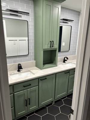 Bathroom remodel - Remodel was done in a 1970s home. It is a jack and Jill bathroom features a spacious walk-in shower with plenty of storage and a pair of sinks fit for royalty