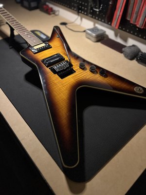 Dean ML - A Dean Dimebag Tribute ML is a specially designed guitar that pays homage to the legendary guitarist Dimebag Darrell of Pantera and Damageplan. Known for his aggressive riffs and iconic tone, Dimebag left an indelible mark on the metal music scene, and the Tribute ML series reflects his spirit and style. Dean ML - A Dean Dimebag Tribute ML is a specially designed guitar that pays homage to the legendary guitarist Dimebag Darrell of Pantera and Damageplan. Known for his aggressive riffs and iconic tone, Dimebag left an indelible mark on the metal music scene, and the Tribute ML series reflects his spirit and style.