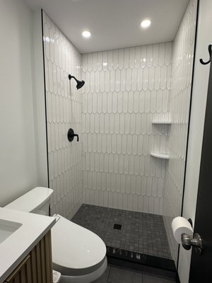 Master Bathroom, Falls Church, VA. - second bathroom in the same home, we remodeled the outdated master bathroom by expanding the standing shower. We removed an old-fashioned open closet behind the shower wall to increase shower space. The project involved plumbing and electrical modifications, as well as repairing and replacing the water-damaged floor.