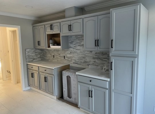 Kitchen remodel - Remodeled clients kitchen by installing new cabinets with countertops and installed backsplash tiling Kitchen remodel - Remodeled clients kitchen by installing new cabinets with countertops and installed backsplash tiling