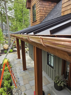 Half Round Seamless Copper Gutter System Installation Seacoast New Hampshire Custom handcrafted Gutters Installed by Local Professionals - Project Spotlight: European Half-Round Copper Gutter Installation in Meredith New Hampshire
At New England Gutter Systems, we recently completed a remarkable project involving the installation of European half-round copper gutters in Meredith. This project showcased our commitment to quality, craftsmanship, and customer satisfaction.
We began with an in-depth consultation with the homeowner to understand their vision and specific needs. The homeowner wanted a gutter system that not only provided superior performance but also enhanced the aesthetic appeal of their property. After discussing various options, we recommended European half-round copper gutters for their timeless elegance and durability.
Copper was chosen for its unmatched durability and natural beauty. Over time, copper develops a unique patina that adds character and charm to the home. It is also resistant to rust and corrosion, making it an ideal choice for the Seacoast NH climate.
Our skilled team meticulously installed the half-round copper gutters, ensuring precision and attention to detail at every step. The rounded shape of these gutters allows for better water flow and reduces the risk of clogging, which is essential for managing New England Seacoast heavy rainfall and snow.
We took great care to ensure that the new gutter system seamlessly integrated with the home’s existing architecture. The copper gutters complement character of the property, adding a touch of sophistication and elegance.
Throughout the installation, our owner was on-site to oversee the project and ensure that every detail met our high standards of quality and professionalism. We conducted thorough inspections at each phase of the installation to guarantee exceptional workmanship.
The homeowner was delighted with the results. The European half-round copper gutters not only provided functional benefits but also significantly enhanced the curb appeal of their historic home. The positive feedback from the homeowner affirmed our commitment to delivering top-notch service and quality.
Benefits of European Half-Round Copper Gutters:
Timeless Elegance:
Copper gutters offer a classic and sophisticated look that enhances the aesthetic appeal of any home. The half-round design adds a touch of European charm, making these gutters a standout feature.
Superior Durability:Copper is renowned for its longevity and durability. It can withstand the harsh New England weather, including heavy snow, ice, and rain, without corroding or rusting. This ensures that the gutter system will remain functional and beautiful for decades.
Low Maintenance:Copper gutters require minimal maintenance. They naturally develop a patina that protects against corrosion and damage, reducing the need for frequent cleaning and upkeep.
Enhanced Water Flow:The half-round shape of these gutters allows for better water flow compared to traditional K-style gutters. This reduces the risk of clogging and ensures efficient drainage during heavy rainfall.
Eco-Friendly:Copper is a sustainable and recyclable material. Choosing copper gutters is an environmentally responsible decision that reduces the need for replacements and minimizes waste.
Local Expertise and Warranty:At New England Gutter Systems, our local expertise sets us apart. We understand the unique challenges posed by New England’s weather patterns and tailor our solutions to meet these demands. Our team’s extensive experience ensures that every installation is performed with precision and care.
25-Year Warranty:We stand by the quality of our work with a comprehensive 25-year warranty on all labor. This warranty reflects our confidence in the durability and performance of our gutter systems. If any issues arise, our team is committed to providing prompt and effective solutions, ensuring your peace of mind.
The European half-round copper gutter installation in New Hampshire is a testament to our dedication to excellence. At New England Gutter Systems, we combine superior materials, skilled craftsmanship, and personalized service to deliver outstanding results. Whether you own a historic home or a modern property, our gutter solutions are designed to enhance both functionality and beauty.
Trust New England Gutter Systems for all your gutter installation needs. Contact us today to schedule a consultation and experience the difference of working with the region’s premier gutter experts. Your home deserves the best, and we are here to provide it. Half Round Seamless Copper Gutter System Installation Seacoast New Hampshire Custom handcrafted Gutters Installed by Local Professionals - Project Spotlight: European Half-Round Copper Gutter Installation in Meredith New Hampshire
At New England Gutter Systems, we recently completed a remarkable project involving the installation of European half-round copper gutters in Meredith. This project showcased our commitment to quality, craftsmanship, and customer satisfaction.
We began with an in-depth consultation with the homeowner to understand their vision and specific needs. The homeowner wanted a gutter system that not only provided superior performance but also enhanced the aesthetic appeal of their property. After discussing various options, we recommended European half-round copper gutters for their timeless elegance and durability.
Copper was chosen for its unmatched durability and natural beauty. Over time, copper develops a unique patina that adds character and charm to the home. It is also resistant to rust and corrosion, making it an ideal choice for the Seacoast NH climate.
Our skilled team meticulously installed the half-round copper gutters, ensuring precision and attention to detail at every step. The rounded shape of these gutters allows for better water flow and reduces the risk of clogging, which is essential for managing New England Seacoast heavy rainfall and snow.
We took great care to ensure that the new gutter system seamlessly integrated with the home’s existing architecture. The copper gutters complement character of the property, adding a touch of sophistication and elegance.
Throughout the installation, our owner was on-site to oversee the project and ensure that every detail met our high standards of quality and professionalism. We conducted thorough inspections at each phase of the installation to guarantee exceptional workmanship.
The homeowner was delighted with the results. The European half-round copper gutters not only provided functional benefits but also significantly enhanced the curb appeal of their historic home. The positive feedback from the homeowner affirmed our commitment to delivering top-notch service and quality.
Benefits of European Half-Round Copper Gutters:
Timeless Elegance:
Copper gutters offer a classic and sophisticated look that enhances the aesthetic appeal of any home. The half-round design adds a touch of European charm, making these gutters a standout feature.
Superior Durability:Copper is renowned for its longevity and durability. It can withstand the harsh New England weather, including heavy snow, ice, and rain, without corroding or rusting. This ensures that the gutter system will remain functional and beautiful for decades.
Low Maintenance:Copper gutters require minimal maintenance. They naturally develop a patina that protects against corrosion and damage, reducing the need for frequent cleaning and upkeep.
Enhanced Water Flow:The half-round shape of these gutters allows for better water flow compared to traditional K-style gutters. This reduces the risk of clogging and ensures efficient drainage during heavy rainfall.
Eco-Friendly:Copper is a sustainable and recyclable material. Choosing copper gutters is an environmentally responsible decision that reduces the need for replacements and minimizes waste.
Local Expertise and Warranty:At New England Gutter Systems, our local expertise sets us apart. We understand the unique challenges posed by New England’s weather patterns and tailor our solutions to meet these demands. Our team’s extensive experience ensures that every installation is performed with precision and care.
25-Year Warranty:We stand by the quality of our work with a comprehensive 25-year warranty on all labor. This warranty reflects our confidence in the durability and performance of our gutter systems. If any issues arise, our team is committed to providing prompt and effective solutions, ensuring your peace of mind.
The European half-round copper gutter installation in New Hampshire is a testament to our dedication to excellence. At New England Gutter Systems, we combine superior materials, skilled craftsmanship, and personalized service to deliver outstanding results. Whether you own a historic home or a modern property, our gutter solutions are designed to enhance both functionality and beauty.
Trust New England Gutter Systems for all your gutter installation needs. Contact us today to schedule a consultation and experience the difference of working with the region’s premier gutter experts. Your home deserves the best, and we are here to provide it.
