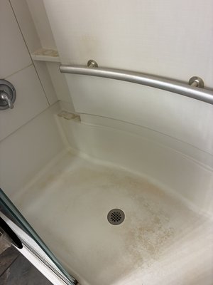 Shower Before V.S After - This shower was covered in soap scum and build-up, I tackled it one corner at a time to make it SPARKLE again! 

At Sam’s Sparkle Haus, I don’t focus on just wiping every surface, I pay close attention to every edge, corner, crack, and detail to leave your home LOOKING & FEELING fresh again!