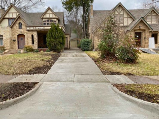 Driveway + Approach + Sidewalk Replacement (Dallas, TX) - This driveway was in terrible shape. Cracked, broken, shifted. We removed it, graded and poured a reinforced replacement.