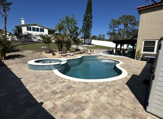 New Pool Construction in Tarpon Springs - New paver pool deck, travertine pool coping, mosaic pool tile, paver patio