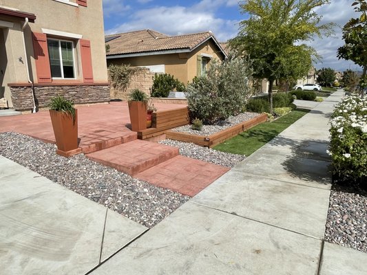 Front yard patio - This front yard was completely redone with stamped concrete, steps, lumber wall, and plants Front yard patio - This front yard was completely redone with stamped concrete, steps, lumber wall, and plants