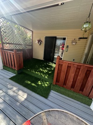 Patio Remodel - This patio needed a refesh. Dull cedar and fading paint were crying out for a refresh. We gave the cedar banisters a beautiful stain coating to bring them to life and installed lush faux grass to brighten the area up and add to the comfort level.