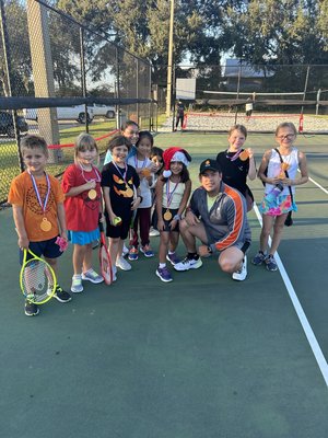 Clermont Tennis Academy Red Ball class - The red ball junior program at Claremont tennis Academy is specifically designed for the youngest tennis enthusiast. Taylor to introduce children to the world of tennis this program utilizes a 36 foot Court and many nets along the red balls that are larger softer and bounce lower than the standard tennis ball. These modifications ensure that the equipment is perfectly suited to the size and strength of young children making it easier for them to hit and control the ball. Each session last about one hour and occurs once a week providing a perfect balance for fun and learning without overwhelming the little ones. In our program is an only focus on technique, basic tennis strokes and coordination, but also emphasize developing match, play motor skills, agility, and early athletic traits. The red ball junior program is a wonderful way for children to begin their (tennis) journey in a supportive and engagement environment.