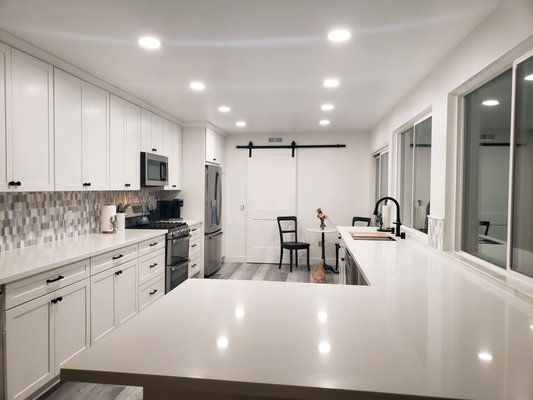 Oceanside Kitchen Remodel - This House in Oceanside needed New Kitchen Cabinets , We took out the old cabinets and installed New Maple White shaker cabinets , New Quartzite countertops and appliance hookups.