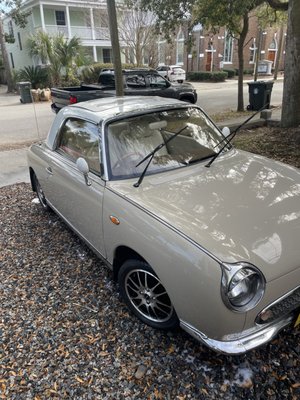 1991 Nissan Figaro - This 1991 Nissan Figaro is a true collector’s car and a rare sight on the road. With limited production, vehicles like this require a careful, preservation-focused approach rather than a standard detail.

We performed a full detail designed to enhance and protect the vehicle while respecting its age and originality. The exterior received a thorough hand wash to safely remove buildup, followed by a protective wax to restore gloss and add a layer of defense to the classic paint. Every step was completed using gentle methods appropriate for a vintage finish.

Inside, the interior was carefully cleaned and refreshed, focusing on preserving original materials while improving overall appearance and cleanliness. Attention was given to the small details that matter most on collector vehicles, ensuring the cabin matched the exterior’s revived look.

This detail brought the Figaro back to a clean, vibrant state while maintaining the integrity of a truly rare and unique automobile.