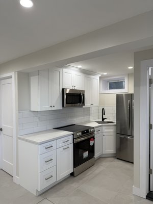 First floor ground up renovation - This was a non existent floor, we dug down about 14 inches to get a 8 foot ceiling height. We did underpinning. We did all new plumbing and electrical. All new framing and layout.  Results speak for themselves.  Stunning results under 2 months.