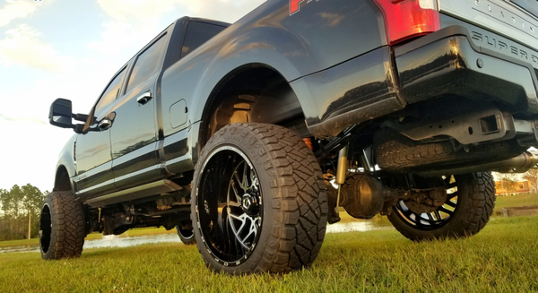 Ford F250 - We can now mount and balance up to 26" wheels for all you big wheel fans. Here we have a set of Nitto Ridge Grappler 37×13.50s stretched to fit the TIS Wheels 544MB 24 x14" wide wheels w a -76 offset. We helped the ride w Fox shocks and a Pure Performance mini leaf pack that absolutely smooths out the rear. Ford F250 - We can now mount and balance up to 26" wheels for all you big wheel fans. Here we have a set of Nitto Ridge Grappler 37×13.50s stretched to fit the TIS Wheels 544MB 24 x14" wide wheels w a -76 offset. We helped the ride w Fox shocks and a Pure Performance mini leaf pack that absolutely smooths out the rear.