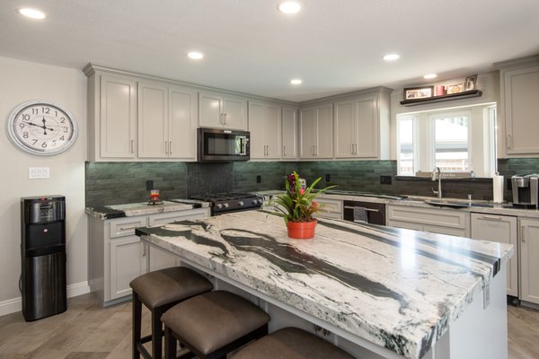 kitchenCRATE Custom Hansen Road - Get ready to fall in love with another breathtaking custom kitchen remodel in Tracy, kCC Hansen Road!
We have fallen in love with the contemporary look and color palette of this transformation.
A few highlights include the beautiful custom cabinetry, granite countertops, ceramic tile backsplash, and new flooring. We love the design decision to open up the kitchen by removing the peninsula and adding an island, which is much more suitable for the space!
We love the stunning design of this recently completed kitchen remodel! Scroll down to even more before & after images! kitchenCRATE Custom Hansen Road - Get ready to fall in love with another breathtaking custom kitchen remodel in Tracy, kCC Hansen Road!
We have fallen in love with the contemporary look and color palette of this transformation.
A few highlights include the beautiful custom cabinetry, granite countertops, ceramic tile backsplash, and new flooring. We love the design decision to open up the kitchen by removing the peninsula and adding an island, which is much more suitable for the space!
We love the stunning design of this recently completed kitchen remodel! Scroll down to even more before & after images!