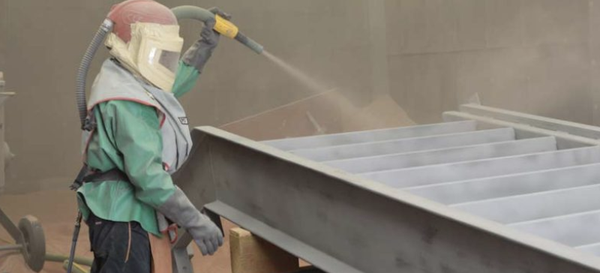 Sandblasting - Sandblasting is the process of propelling pieces of abrasive material at a high velocity onto metal, hospital brick or concrete. This process knocks loose any rust, dirt, dust, chalk and bubbling paint so that the surface can easily be washed clean, resulting in an incredibly smooth surface. Due to the way this technique cleans a surface, sandblasting is often used as a way to prepare the surface prior to painting. Our sandblast room is 20 ft x 40 ft and on location so once the product is completely sandblasted it will be ready and on its way to the painting process. Sandblasting - Sandblasting is the process of propelling pieces of abrasive material at a high velocity onto metal, hospital brick or concrete. This process knocks loose any rust, dirt, dust, chalk and bubbling paint so that the surface can easily be washed clean, resulting in an incredibly smooth surface. Due to the way this technique cleans a surface, sandblasting is often used as a way to prepare the surface prior to painting. Our sandblast room is 20 ft x 40 ft and on location so once the product is completely sandblasted it will be ready and on its way to the painting process.