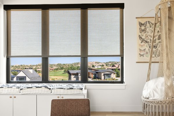 Shades in Ravenna - A variety of shade styles beautifully complement this modern home, offering both privacy and a touch of elegance.  A combination of light filtering, solar & blackout shades, motorized with Somfy motors and black metal square fascia.