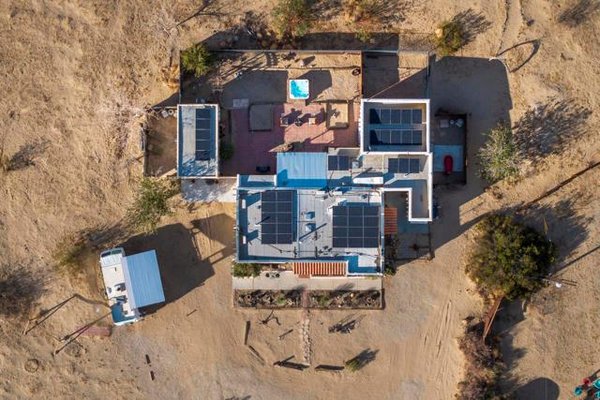 66760 Sunnyslope Dr - Joshua Tree Compound SOLD! - Welcome to your desert retreat at the base of Copper Mountain in Joshua Tree, CA! This spacious 5-bedroom, 3-bathroom home, including a detached ADU and an adorable RV with a deck for guests, offers 2,056 sq. ft. of living space, framed by stunning mountain views.Equipped with mini splits in every room for ultimate comfort, and a multi-panel solar system for eco-friendly living, this home is designed for both summer heat and cooler desert nights. Cozy up next to the potbelly stove in the Zen lounge or enjoy the updated, newly renovated kitchen, open-concept living space, and covered patio for outdoor entertaining.Unwind with outdoor bathtubs, a shower, and a hot tub for stargazing. 66760 Sunnyslope Dr - Joshua Tree Compound SOLD! - Welcome to your desert retreat at the base of Copper Mountain in Joshua Tree, CA! This spacious 5-bedroom, 3-bathroom home, including a detached ADU and an adorable RV with a deck for guests, offers 2,056 sq. ft. of living space, framed by stunning mountain views.Equipped with mini splits in every room for ultimate comfort, and a multi-panel solar system for eco-friendly living, this home is designed for both summer heat and cooler desert nights. Cozy up next to the potbelly stove in the Zen lounge or enjoy the updated, newly renovated kitchen, open-concept living space, and covered patio for outdoor entertaining.Unwind with outdoor bathtubs, a shower, and a hot tub for stargazing.