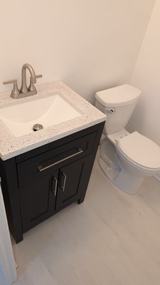 Toilet, Vanity, and Faucet Installment - Customer was very happy with the installation. We replaced all three valves in powder bathroom. We installed a new toilet, a new PVC toilet flange, and secured to the floor with screws. Customer. Then we installed the vanity, countertop and faucet on site.