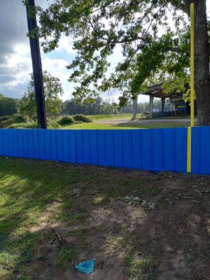 Fencing - Painted fencing surrounding a little league field