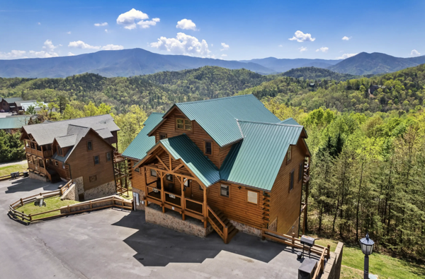 Vista Lodge *Book One Week And Save* - VISTA LODGE - overlooking the Great Smoky Mountains

Vista Lodge is a recently renovated, clean, and comfortable cabin offering breathtaking views of the Great Smoky Mountains National Park. Relax in the hot tub while gazing at the scenic beauty, enjoy a movie night in the theater room, or have fun in the game room featuring a TV, pool table, air hockey, and arcade game. Located just 13 miles from the Parkway in Pigeon Forge and 22 miles from Cades Cove, Vista Lodge is the perfect location for a mountain retreat.

You will be amazed at all this property has to offer! There are 2 king bedrooms with ensuite bathrooms (w/jacuzzi tubs) on the main floor adjacent to the open-concept kitchen, dining room and living room. Enjoy the private hot tub right on the main level deck overlooking the beautiful Smoky Mountains! On the upper level there are 2 additional king bedrooms adjacent to the game room. In the game room, there is also a queen sofa bed for additional sleeping. The bunk room is located on the lower level and has 3 twin over twin bunk beds. Perfect for all the kids to stay in 1 room!
The game room has everything any kid (or adult) could want! Play a game of pool or air hockey while watching the game or movie on the smart TV or test your skills on the multicade!
The theater room is also located on the lower level. Relax after a long day at the National Park with a movie on the 85in smart TV, surround sound and brand new couches arranged in raised theater style seating! Pop some popcorn in microwave conveniently located right in the theater room! Free WiFi and Cable! Netflix, Hulu, etc are available (BYO passwords) on the smart TV's. Each king bedroom also has a smart TV in the room.
Enjoy the Resort amenities - outdoor pool (seasonal), weight room, sauna, wedding chapel, etc.

This cabin is located in the beautiful Preserve Resort with magnificent views! This area is known for being the "quiet side of the mountain" in the heart of Wears Valley. Perched on a ridgetop surrounding Pigeon Forge, Gatlinburg, Sevierville and Townsend, makes this cabin the perfect place to be, centrally located to all the amazing activities the area has to offer! Located only 10 minutes from the Great Smoky Mountain National Park and located closest to Cades Cove than any other resort in the area! So, prepare to relax and unwind, from the everyday hustle and bustle, as you enjoy the spectacular view of the Smoky Mountains right from the comfort of your beautiful, luxurious cabin called Vista Lodge!

All roads in the Preserve are paved and well-maintained but steep in some places. There is ample parking in front of the cabin, enough room for 5 cars! Please park only in front of Vista Lodge cabin. There is no off-site parking available. Please do not park at any other cabin parking areas.

Vista Lodge is located in the mountains for a quiet, tranquil stay but, is also within 30 min to an hour to all area attractions including, but not limited to, countless outdoor activities in the Great Smoky Mountain National Park, the Parkway in Pigeon Forge, Dollywood and Splash Country, Cades Cove, and Gatlinburg! It is also located minutes from Townsend which has cute little cafe's, restaurants, gift shops, antiques shops and much more! There is something for everyone here! You won't be disappointed, and you will want to come back to stay at Vista Lodge year after year!