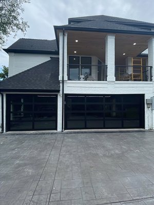Modern Glass Doors - Upgrading this home with two new glass doors helped increase the homeowners sale price. Before the glass doors were installed the home had 2 standard steel doors. Knowing their investment was going to pay off made for a very satisfying install.