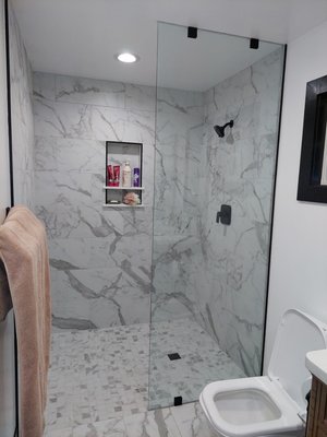Commercial and residential glass & mirrors service - On the shower though the customer request a fixed panel