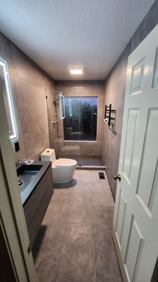 Before and After - What started as a request for minor bathroom updates quickly turned into a complete remodel. Our team delivered a full transformation—exceeding expectations and coming in under budget. The client was so thrilled with the results that they immediately invited us back to refresh their living room next!