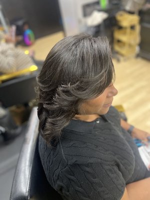 Silk Press - Elevate your style with our flawless silk press at Salon Hairapy. Your hair deserves this level of luxury