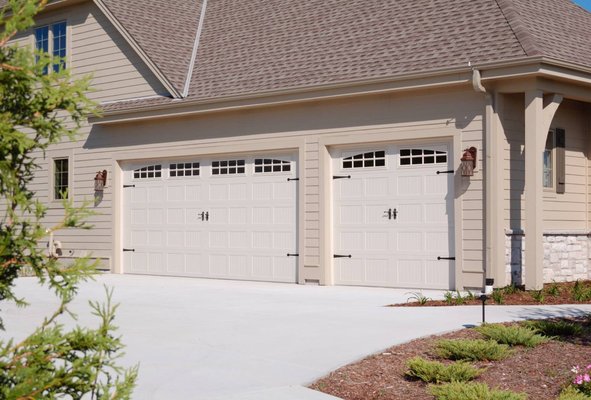 STAMPED CARRIAGE GARAGE DOORS - Simple design and functionality meet traditional style in our stamped carriage house garage doors.
Rustic craftsmanship brings warmth and individuality to your garage door. Available in short and long panel designs, the embossed frame, recessed beveled edge, and vertical pressed lines of each panel lend your home’s exterior a touch of classic charm. STAMPED CARRIAGE GARAGE DOORS - Simple design and functionality meet traditional style in our stamped carriage house garage doors.
Rustic craftsmanship brings warmth and individuality to your garage door. Available in short and long panel designs, the embossed frame, recessed beveled edge, and vertical pressed lines of each panel lend your home’s exterior a touch of classic charm.