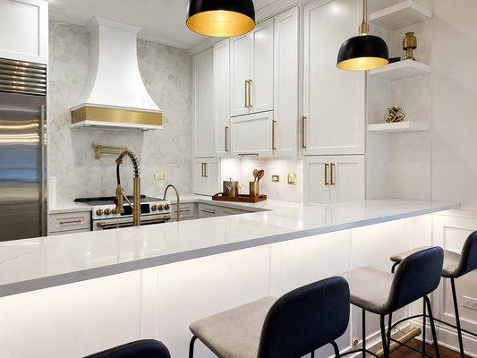 Kitchen Remodel - Complete kitchen remodel featuring semi-custom cabinetry, quartz countertops, full-height stone backsplash, and range hood Kitchen Remodel - Complete kitchen remodel featuring semi-custom cabinetry, quartz countertops, full-height stone backsplash, and range hood