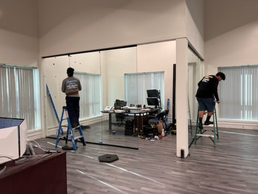 90⁰ Office Room Glass Walls and Door - This project was a construction for a VIP client's office. We've been working together for a very long time and have acquired their tastes with similar projects we've done for them in the past. This project features 6 glass panels and 1 custom door. The adjustment of the glass panels and application of the silicone gave the office a premium look and degree of soundproofing. Our client was yet again amazed by our work and has yet to call us for any issues with the project. 90⁰ Office Room Glass Walls and Door - This project was a construction for a VIP client's office. We've been working together for a very long time and have acquired their tastes with similar projects we've done for them in the past. This project features 6 glass panels and 1 custom door. The adjustment of the glass panels and application of the silicone gave the office a premium look and degree of soundproofing. Our client was yet again amazed by our work and has yet to call us for any issues with the project.