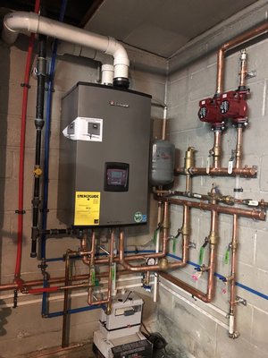 Oil to Gas Conversion - We removed the old oil boiler and water heater and installed a high-efficiency combination boiler which took place of both old units. Not only will they save money by not using oil, but they will also save money because the new boiler combi unit has an efficiency rate above 98%. It also created much more room in the basement as the two older units were extremely huge and the new wall hung unit took the place of both of them is much smaller and hung on a wall in a corner.