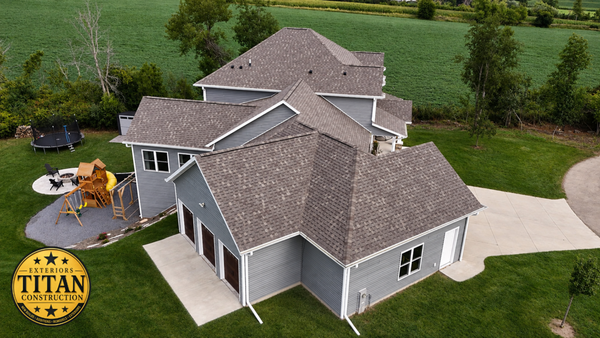 Full Exterior Renovation - After a powerful storm damaged this home, Titan Exteriors & Construction helped restore its exterior with all new roofing, siding, windows, and doors. A complete exterior transformation built to protect the home and look great for years to come.