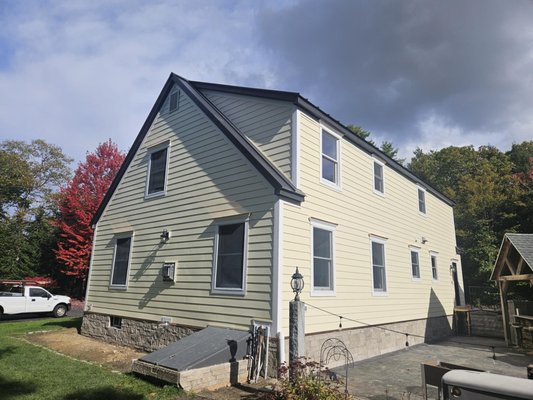Everlast Composite cladding - Remove and replace old vinyl siding. Replace with Everlast composite cladding horizontal lap in the color "Antique Ivory". Custom PVC casings with PVC crown moldings and custom fabricated copper flashing drip cap and foundation flashing. Thank you Loren!