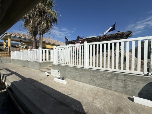 Retaining wall install - Removed a old wooden retaining wall and installed new concrete retaining wall.