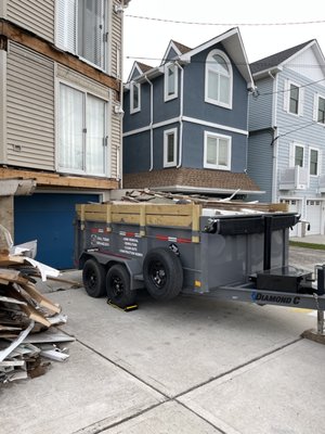 Ocean City Deck Disposal - Here we partnered with a local contractor to haul away a three story deck in Ocean City. Ocean City Deck Disposal - Here we partnered with a local contractor to haul away a three story deck in Ocean City.
