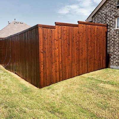 Clean and stain on fence - This fence had hail damage and was weathered, this is after we cleaned it and stained it