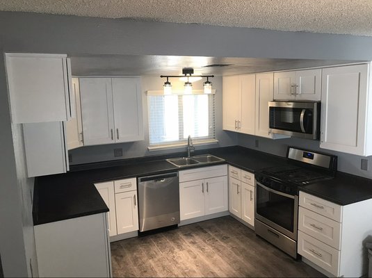 Cabinet paint / Installation - This remodel was of dark brown cabinets that were painted white as well as flooring done and paint done!
The cabinets were disassembled to create the highest quality finish on each side.
Then they were reinstalled with the new countertop addition!
This is Backed by our 1 Year Craftsmanship Warranty!