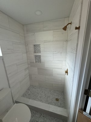 Whole-Home Renovation After Hurricane Ida - This renovation project showcases our expertise in restoring and transforming a hurricane-damaged home into a beautifully modern and functional space. Following the devastation of Hurricane Ida, we worked closely with the homeowner and their insurance company, as well as LIGA, to ensure every detail of this home was thoughtfully addressed. This project not only involved repairing structural damage but also creating a home that better suited the client’s style and needs. Taking advantage of the complete gut renovation, the homeowner opted for additional out-of-pocket upgrades to enhance the functionality and design of their space. Whole-Home Renovation After Hurricane Ida - This renovation project showcases our expertise in restoring and transforming a hurricane-damaged home into a beautifully modern and functional space. Following the devastation of Hurricane Ida, we worked closely with the homeowner and their insurance company, as well as LIGA, to ensure every detail of this home was thoughtfully addressed. This project not only involved repairing structural damage but also creating a home that better suited the client’s style and needs. Taking advantage of the complete gut renovation, the homeowner opted for additional out-of-pocket upgrades to enhance the functionality and design of their space.