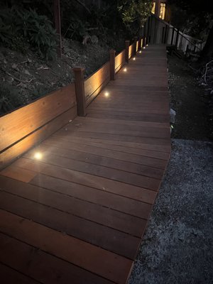 Custom deck lighting installation completed in Muir Beach. - This project focused on integrating low-voltage lighting into a wood deck to enhance both safety and aesthetics. Fixtures were strategically placed along the deck perimeter and steps to provide subtle, even illumination without overpowering the natural surroundings.

All wiring was concealed within the structure to maintain a clean finish, and the system was designed for long-term reliability and outdoor conditions.

The result is a warm, inviting pathway that improves nighttime visibility while complementing the overall design of the space.