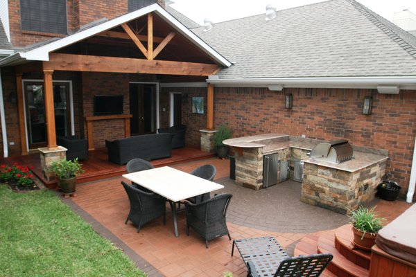 Covered Patio with Outdoor Kitchen and Paver Patio - Custom designed and built outdoor living space with covered patio, outdoor kitchen, deck, and paver patio. Covered Patio with Outdoor Kitchen and Paver Patio - Custom designed and built outdoor living space with covered patio, outdoor kitchen, deck, and paver patio.
