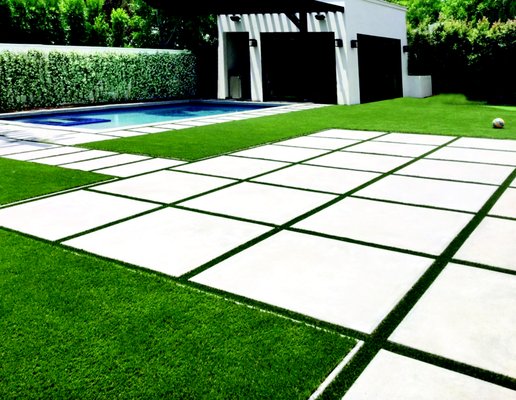 Turf and Pavers around pool in backyard. - This Brentwood installation showcases a few of our specialties! We can create a stunning outdoor areas with concrete pavers and turf to designate different areas of your yard for patio lounge areas, pool surround or play or pet areas. Turf and Pavers around pool in backyard. - This Brentwood installation showcases a few of our specialties! We can create a stunning outdoor areas with concrete pavers and turf to designate different areas of your yard for patio lounge areas, pool surround or play or pet areas.