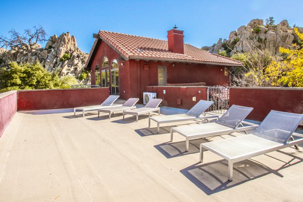 Luxury Yucca Valley Estate in the Boulders - Topanga Canyon meets Joshua Tree! Boulder Grove Ranch is an expansive estate spanning over 8+ acres of privately owned hills and canyon. Nestled amidst a bouldered enclave and on the edge of two private boulder valleys, this thriving Airbnb property features a large two-story home with a spacious suite & private bath, a guest loft, a semi-detached guest house, and elevated views that stretch for miles. Per City of Yucca Valley, WEDDING VENUE usage is now possible with permit - (buyer to verify with City of Yucca Valley). This has HUGE potential with a property such as this, as it boasts such stunning, classic Hi-Desert features! The estate is surrounded by untouched natural beauty that rivals Joshua Tree National Park, establishing itself as one of the premier destinations in the entire High Desert. Luxury Yucca Valley Estate in the Boulders - Topanga Canyon meets Joshua Tree! Boulder Grove Ranch is an expansive estate spanning over 8+ acres of privately owned hills and canyon. Nestled amidst a bouldered enclave and on the edge of two private boulder valleys, this thriving Airbnb property features a large two-story home with a spacious suite & private bath, a guest loft, a semi-detached guest house, and elevated views that stretch for miles. Per City of Yucca Valley, WEDDING VENUE usage is now possible with permit - (buyer to verify with City of Yucca Valley). This has HUGE potential with a property such as this, as it boasts such stunning, classic Hi-Desert features! The estate is surrounded by untouched natural beauty that rivals Joshua Tree National Park, establishing itself as one of the premier destinations in the entire High Desert.